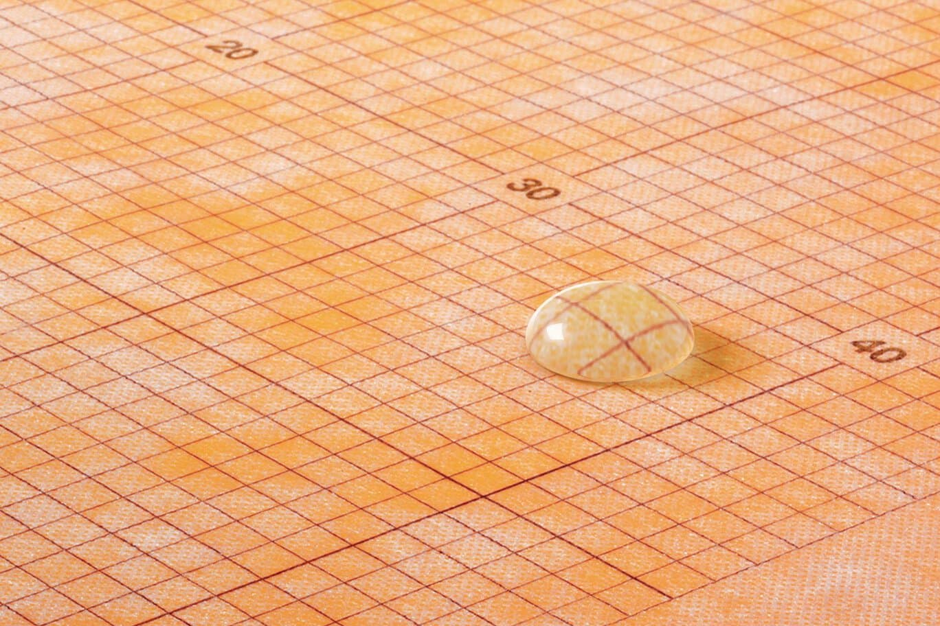 Schluter KERDI waterproofing membrane — water bead on orange membrane
